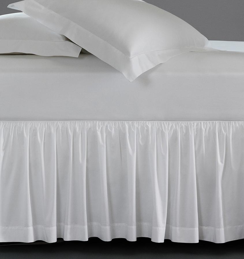 A luxury SFERRA bed skirt in crisp Italian cotton percale. The Celeste Collection is available in an array of colors.