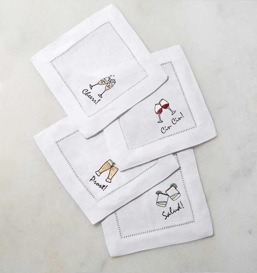 SFERRA Cheers cocktail napkins feature a cheerful selection of four drinks on hemstitched linen napkins.