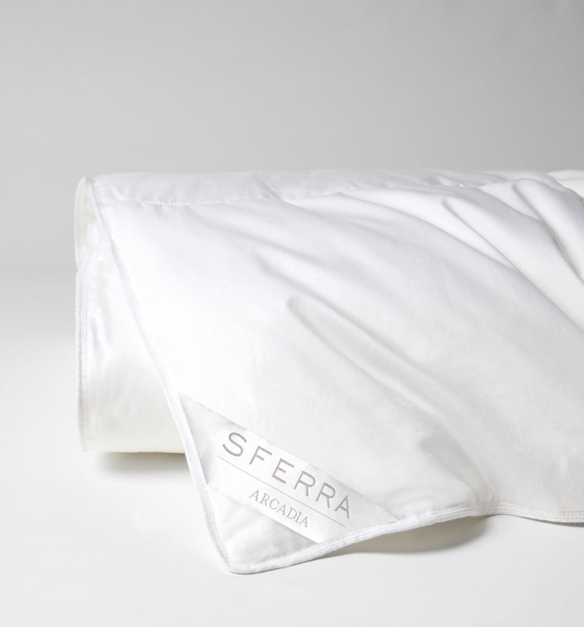 A hypoallergenic microfiber fills SFERRA's Arcadia down alternative duvet.