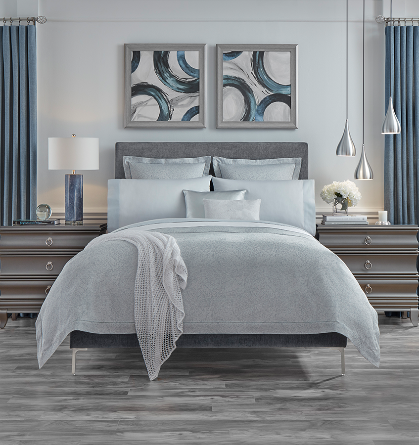 The Gocce Duvet Cover is designed with vivid fluidity, while the soothing coloration of aqua and white is rendered in a subtle ripple effect.