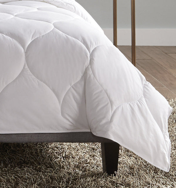 A hypoallergenic microfiber fills SFERRA's Arcadia down alternative duvet.