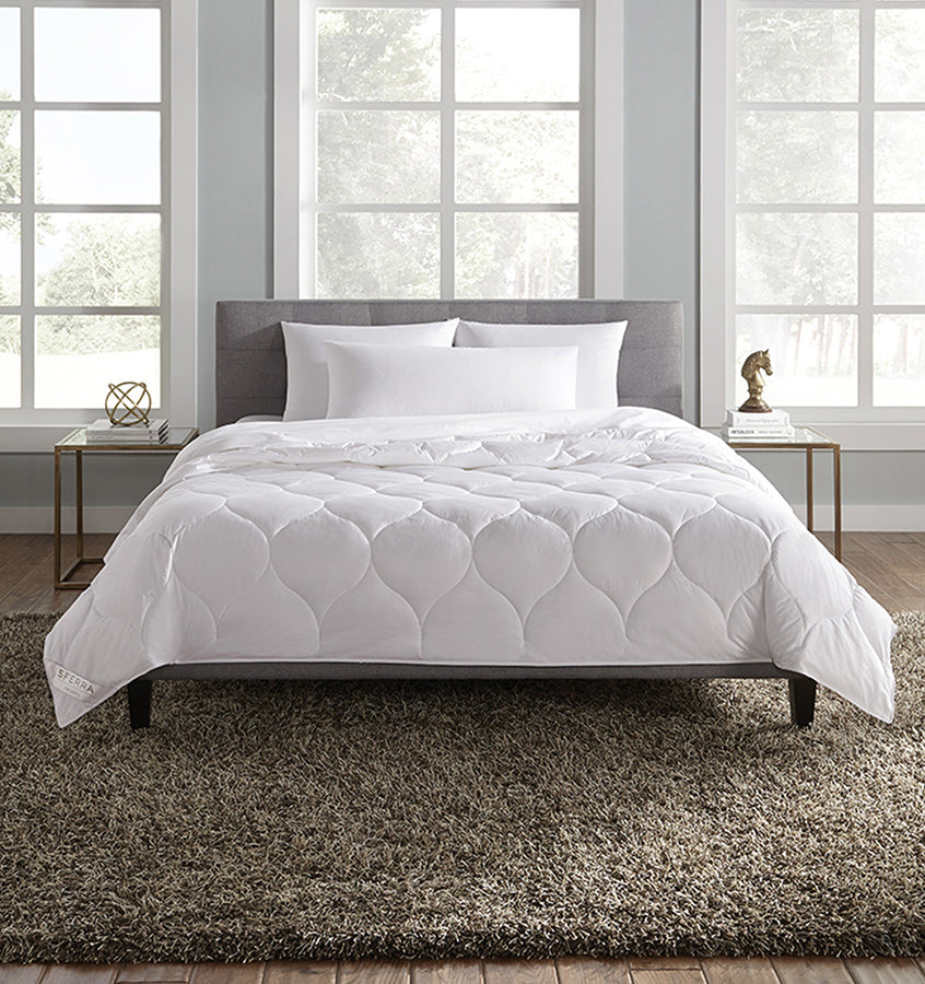 A hypoallergenic microfiber fills SFERRA's Arcadia down alternative duvet.