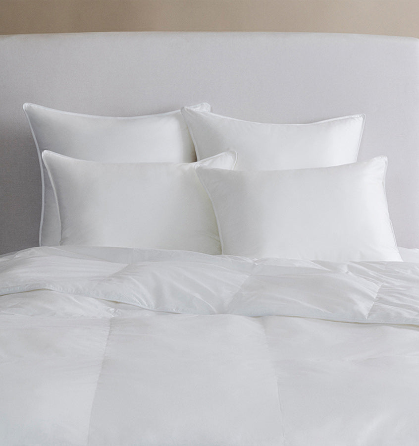 A hypoallergenic microfiber fills SFERRA's Arcadia down alternative duvet.