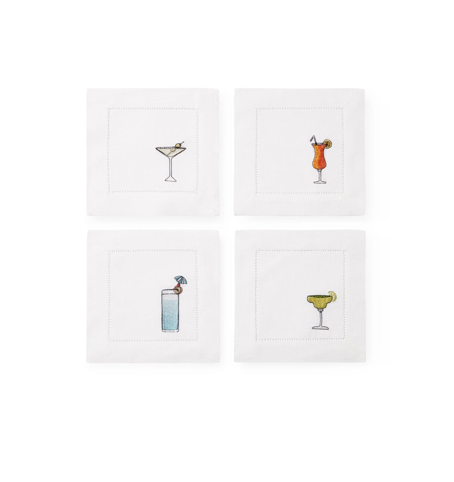 SFERRA Bevande cocktail napkins feature a Martini, Margarita, Orange Crush and Blue Hawaiian on hemstitched linen napkins.