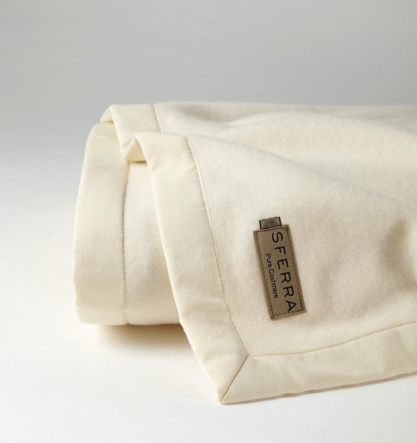 The luxury SFERRA Savoy Blanket, a pure cashmere ivory blanket. 