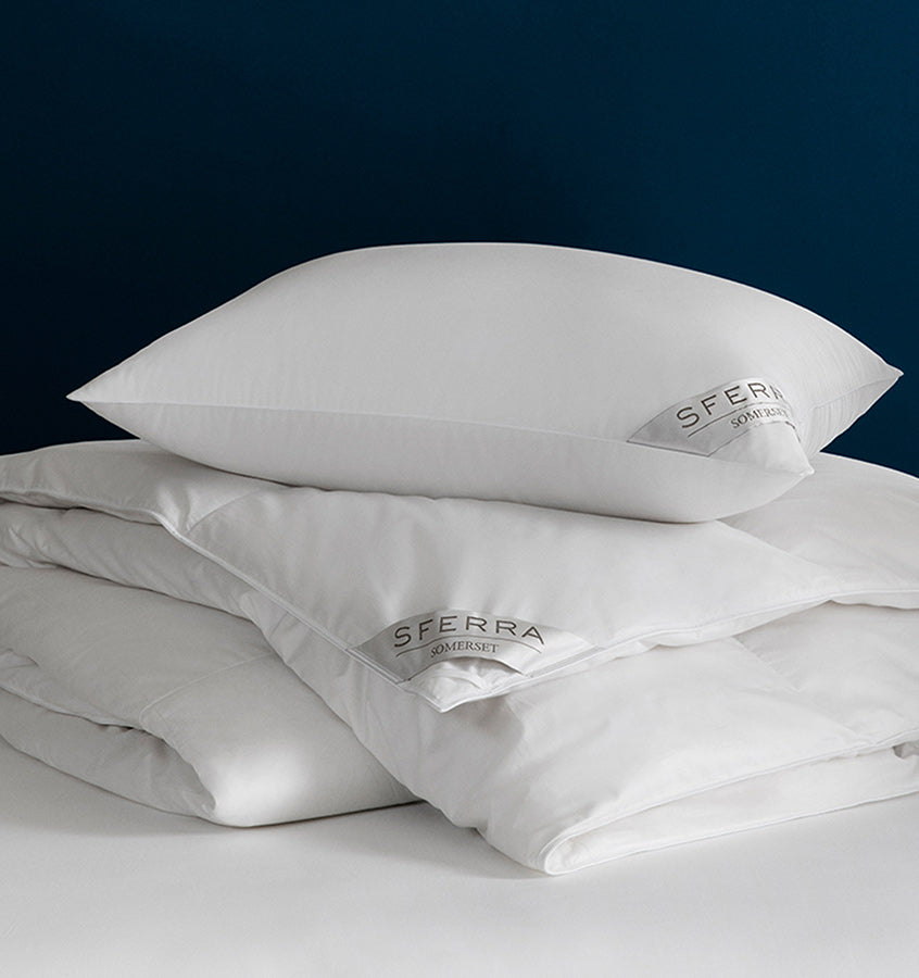 Filled with Polish white goose down and encased in a pure cotton sateen, the Somerset duvet and pillows keep their dreamy loft night after night.