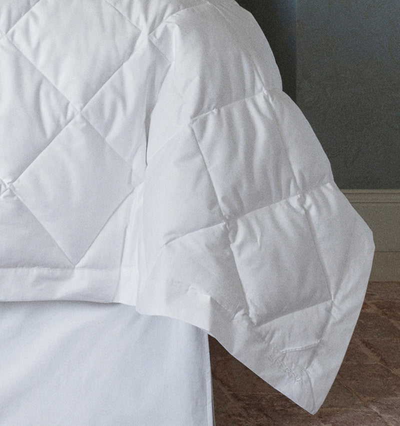 While Tilney functions as a down blanket, it can also serve as a an ultra-light duvet insert.